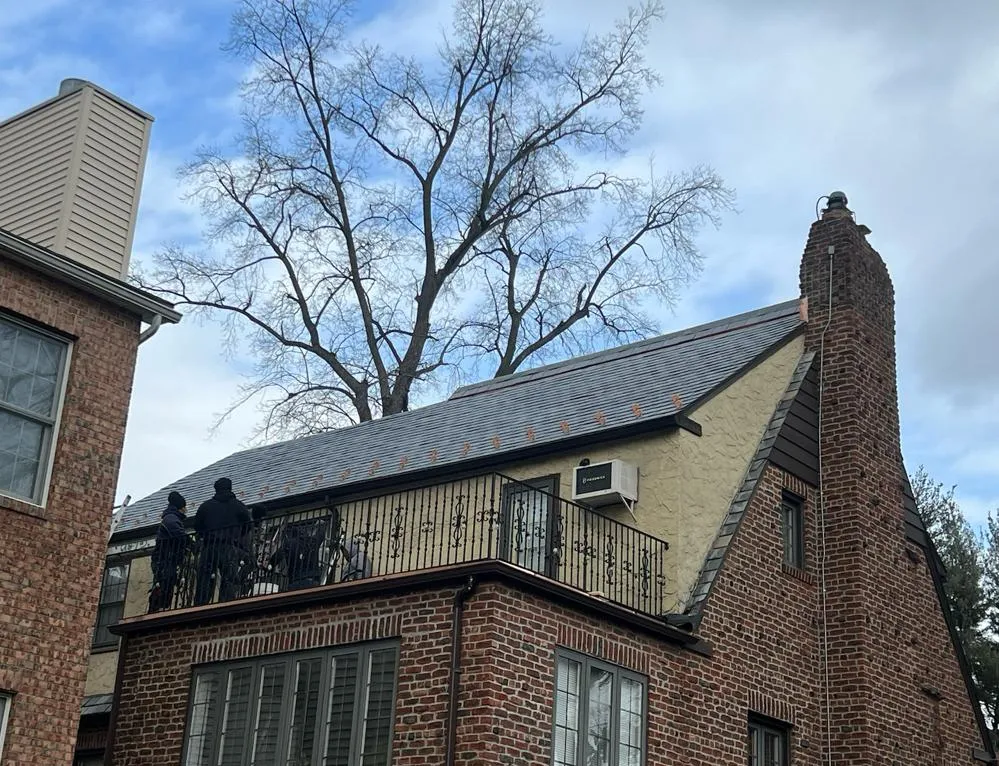 Glen Roofing crew finishing a slate roof